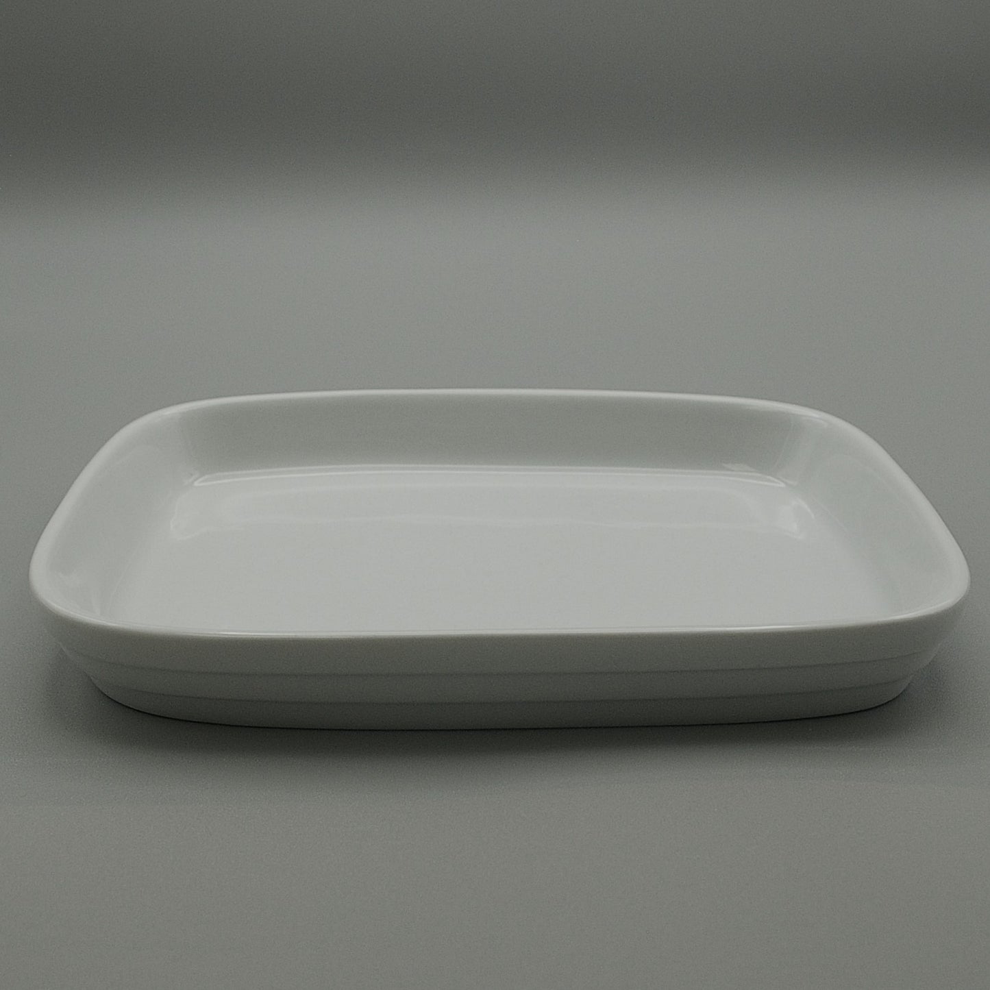 RPCW-75/55 - Porcelain 7.5'' x 5.5'' Rectangular Flat Bottom White Rethrema Plate